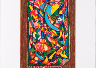 A colorful, abstract artwork reminiscent of Paula Wilson’s style, resembling a vibrant, patterned textile or rug with intertwining shapes and bold colors, placed on a brown wooden-textured background. One corner of the rug is folded over.