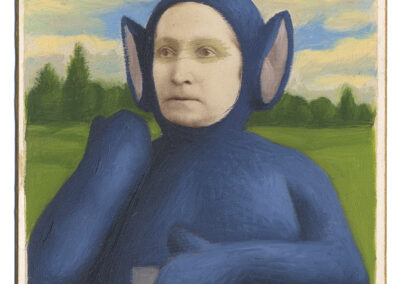 A vintage portrait of a person with a serious expression, edited to wear a blue Teletubby costume with triangular antenna in the style of Alex Gross, photographed before a field and cloudy sky. The card reads "Frank Moore, Muncie, Ind.