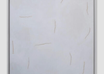 A white canvas with faint, irregular tan lines scattered across its surface, framed in a simple silver frame. Created by Bell Mills, the thin and uneven lines form a minimalistic and abstract composition for 2025.