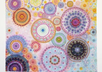A vibrant abstract artwork featuring overlapping and interconnected circles in various sizes and colors, including pinks, purples, blues, oranges, and yellows, creating a kaleidoscopic, swirling 2025-inspired pattern.