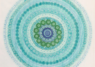 A circular mandala pattern by McConville Munroe, made of small dots in shades of blue, teal, and green, radiates outward in concentric rings against a white background—an inspiring 2025 design.