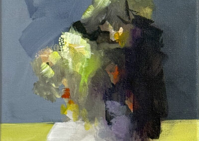 Abstract painting of a roughly vertical cluster of colorful brushstrokes, with greens, yellows, and hints of orange on a grayish background and a yellow-green surface, suggesting a loosely defined bouquet or organic form.