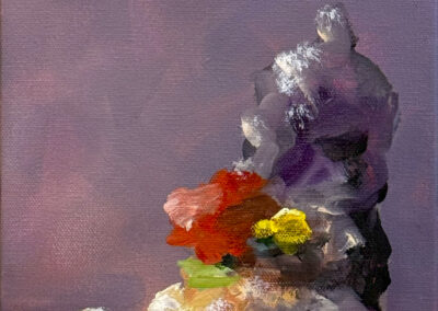 Abstract painting of a colorful, loosely defined mound with red, yellow, green, and white areas on a blue surface against a purple background. The shapes and brushstrokes are soft and textured.