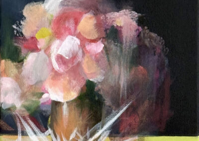 A vase of pink and white flowers sits on a yellow-green surface, with abstract white shards radiating from the base. The background is dark, creating contrast with the soft, colorful petals.