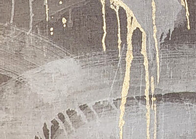 Abstract painting featuring gray and beige brushstrokes with gold paint drips and splatters running vertically across the canvas, creating a textured and dynamic composition.