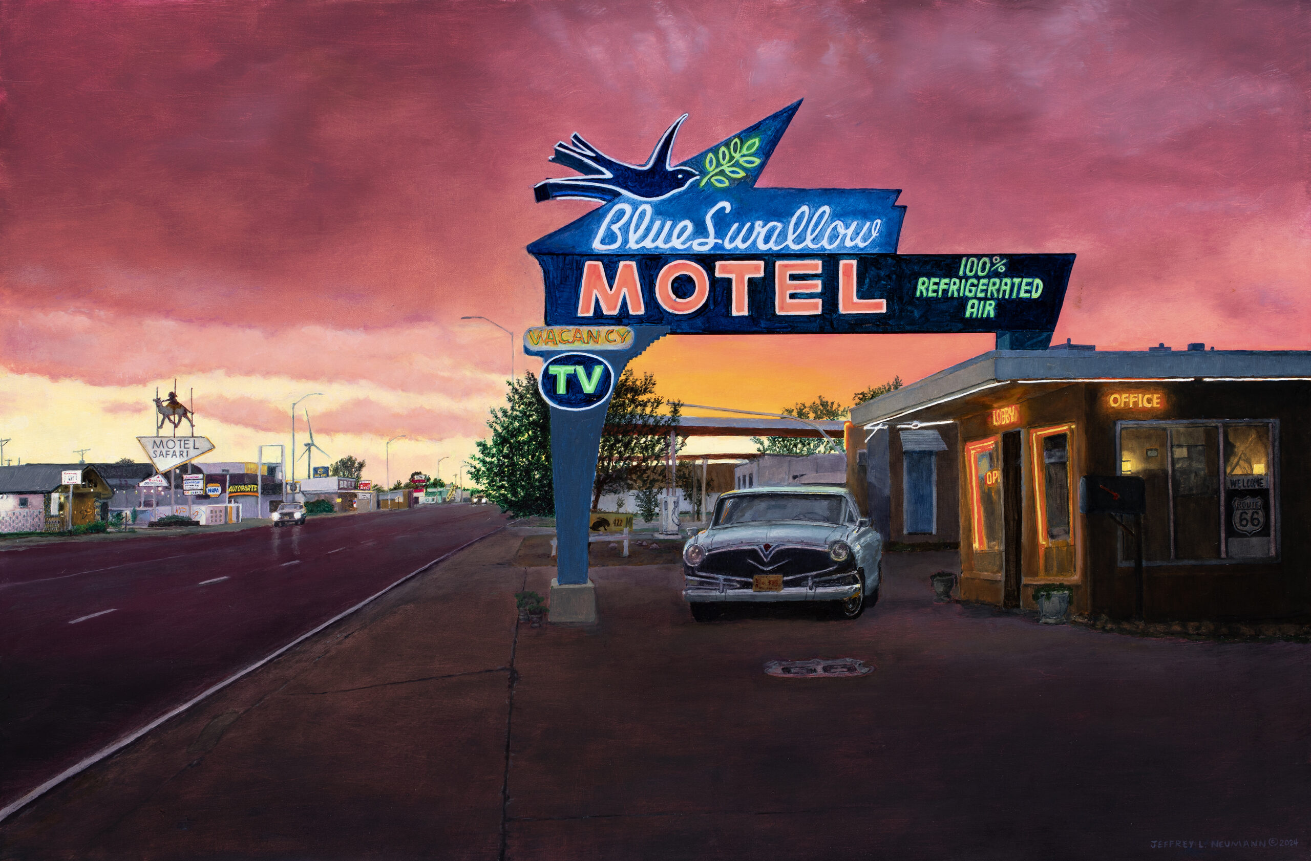 A vintage car sits in front of the Blue Swallow Motel under a sunset sky, with the iconic neon sign from Jeffrey Neumann’s Centennial Collection featuring a blue swallow and the text “Blue Swallow MOTEL 100% REFRIGERATED AIR.”